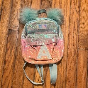 Justice Multicolor Sequin Backpack with Teal Pom Poms